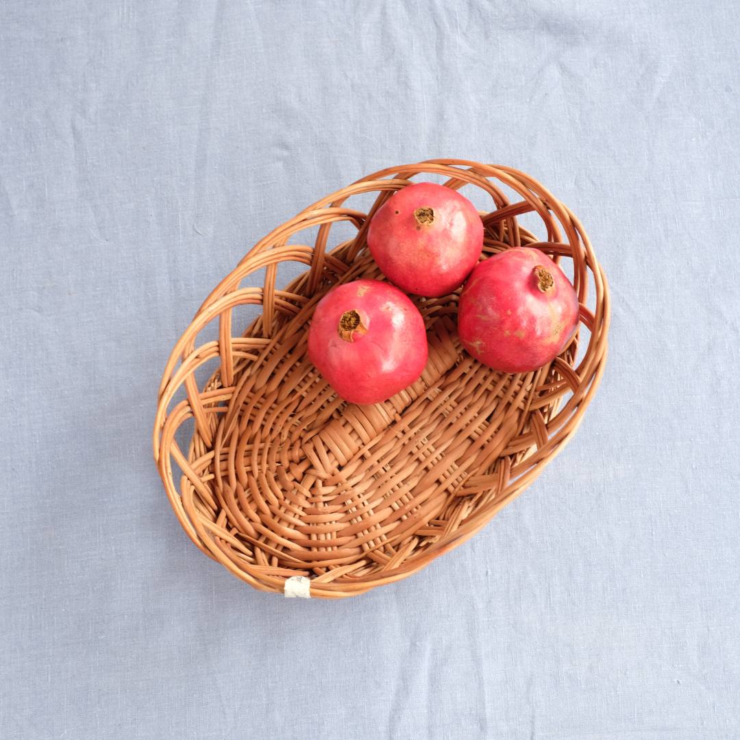 Oval Ring Wicker Basket with fruits.