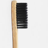 Close up Natural Bamboo Toothbrush with Activated Charcoal Bristles