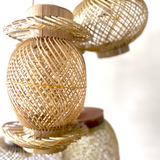 Finely woven natural bamboo lampshade.