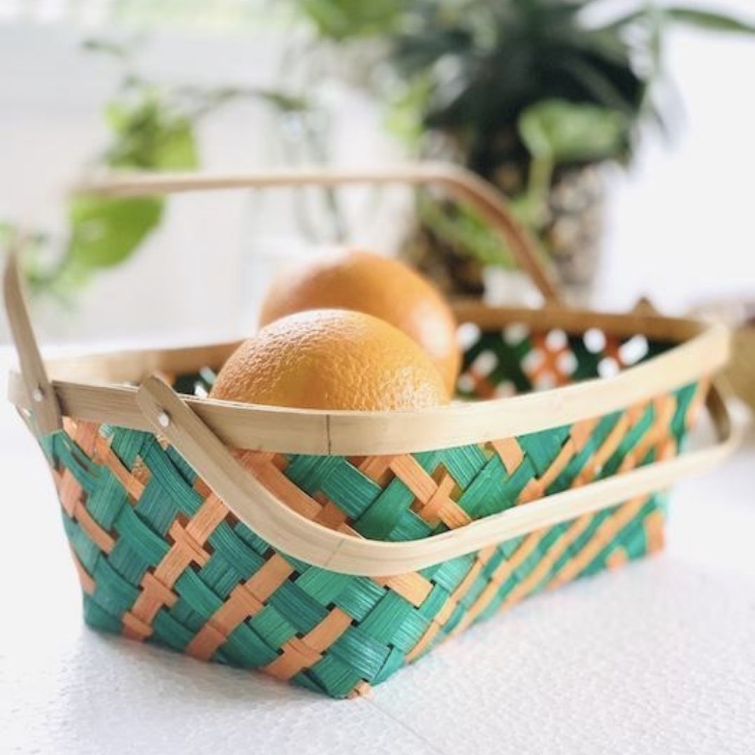 Multicolour natural Caddy Long Tub Bamboo Basket and oranges kept inside