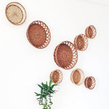 Natural round wicker baskets used for wall installation/ wall décor.