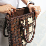 Women carrying natural coconut shell handbag