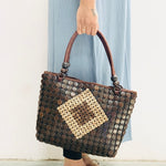 Model holding DaisyLife Coconut natural bags for office and daily use