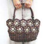 Model holding DaisyLife Real coconut shells sling bag