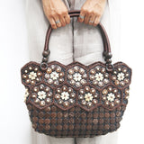 Model holding DaisyLife Real coconut shells sling bag