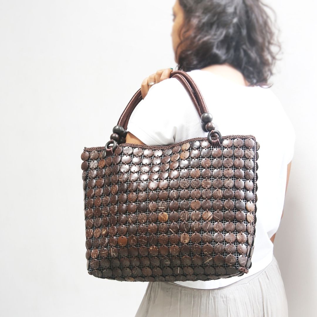 Model holding DaisyLife Coconut natural bags for office and daily use