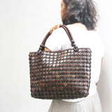 Model holding DaisyLife Coconut natural bags for office and daily use