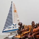 Wooden Natural coral/Seashell ship with blue flag.