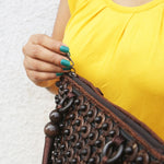 Closeup of DaisyLife coconut bags as natural fashion. A beautiful accessory to add to your outfit.