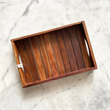 Dry fruits kept on beautiful dark wooden tray