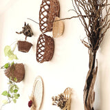 Side view of Forest/ woods basket arrangement for wall decor above dining table