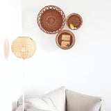 Trio Wall Baskets with book inside the basket with wicker lantern
