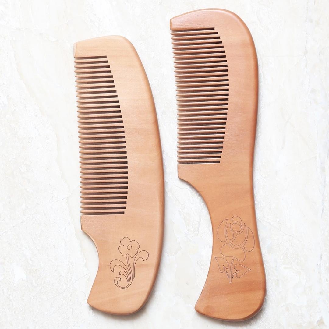 Light wood comb with pretty flower engraving in two different styles