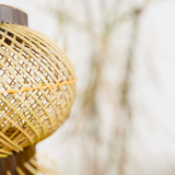 Close up of Finely woven natural bamboo lampshade.