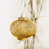 Leaves behind Finely woven natural bamboo lampshade.