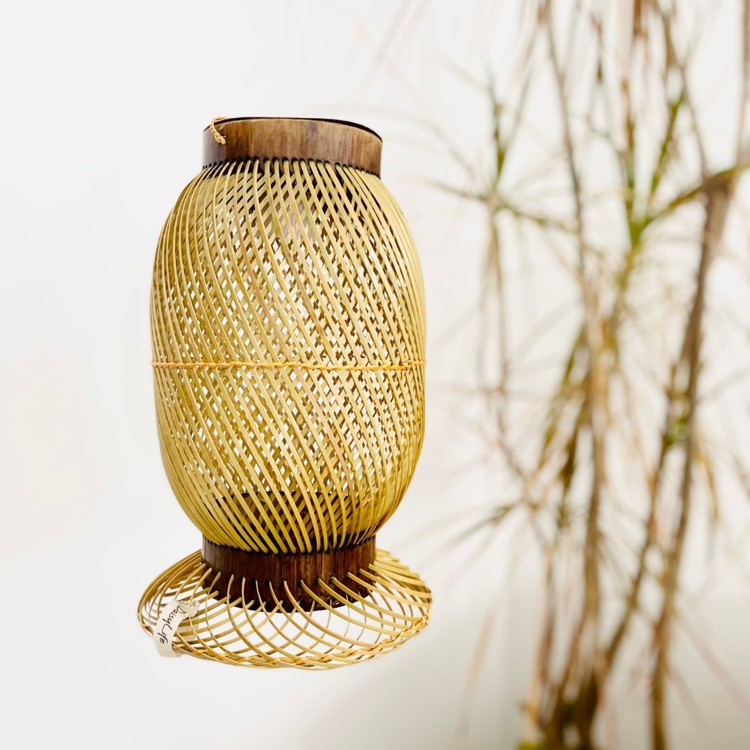 Leaves behind Finely woven natural bamboo lampshade.