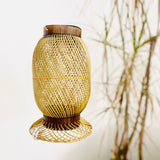 Leaves behind Finely woven natural bamboo lampshade.