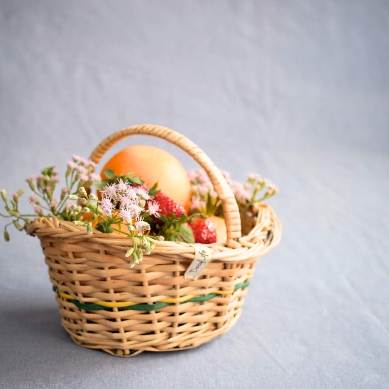 Flower Girl Wicker Basket with flowers and fruits