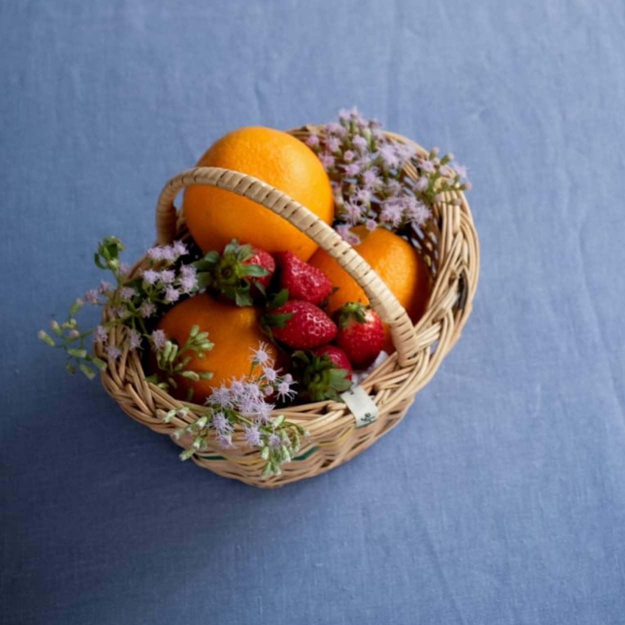 Flower Girl Wicker Basket with flowers and fruits