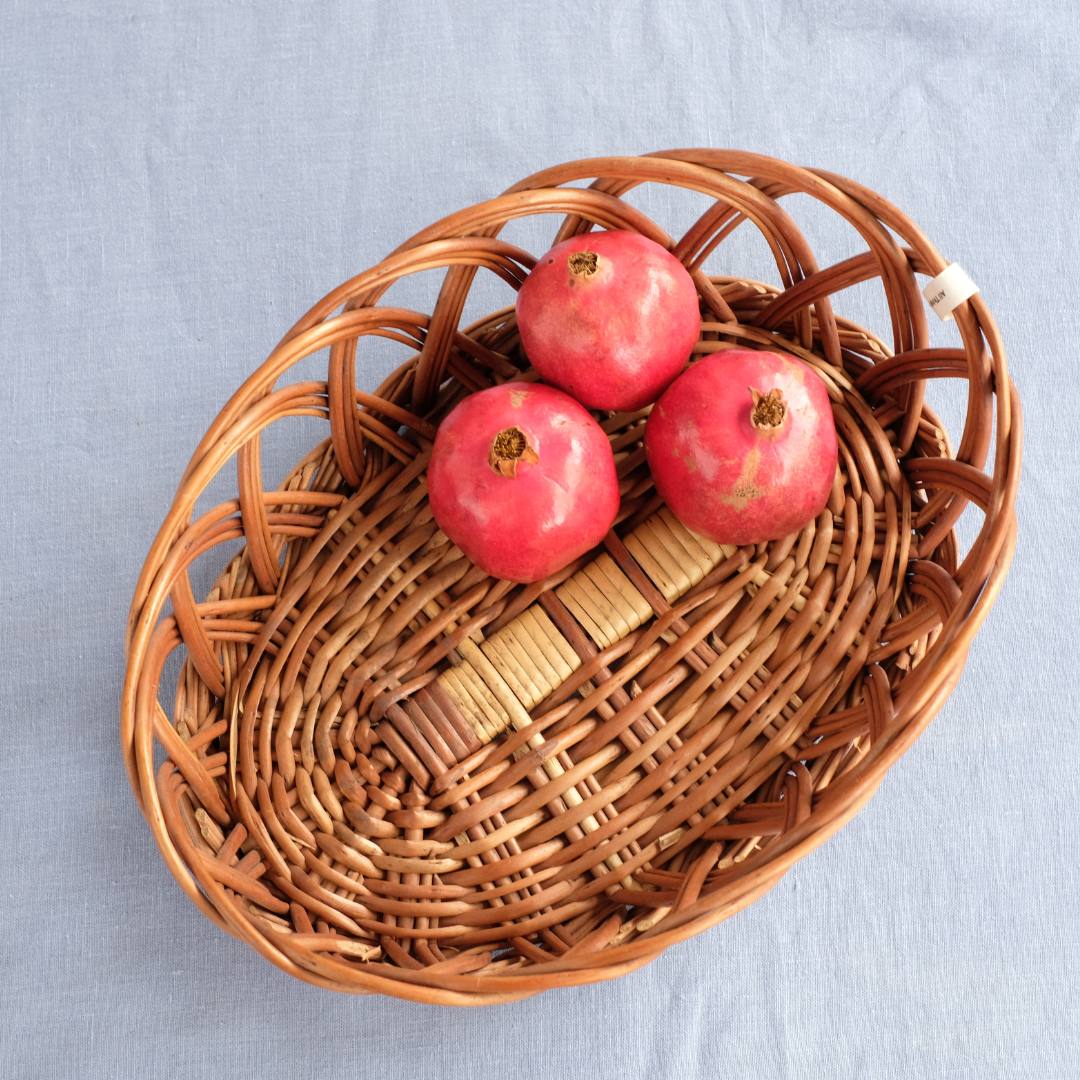 Oval Ring Wicker Basket with fruits.