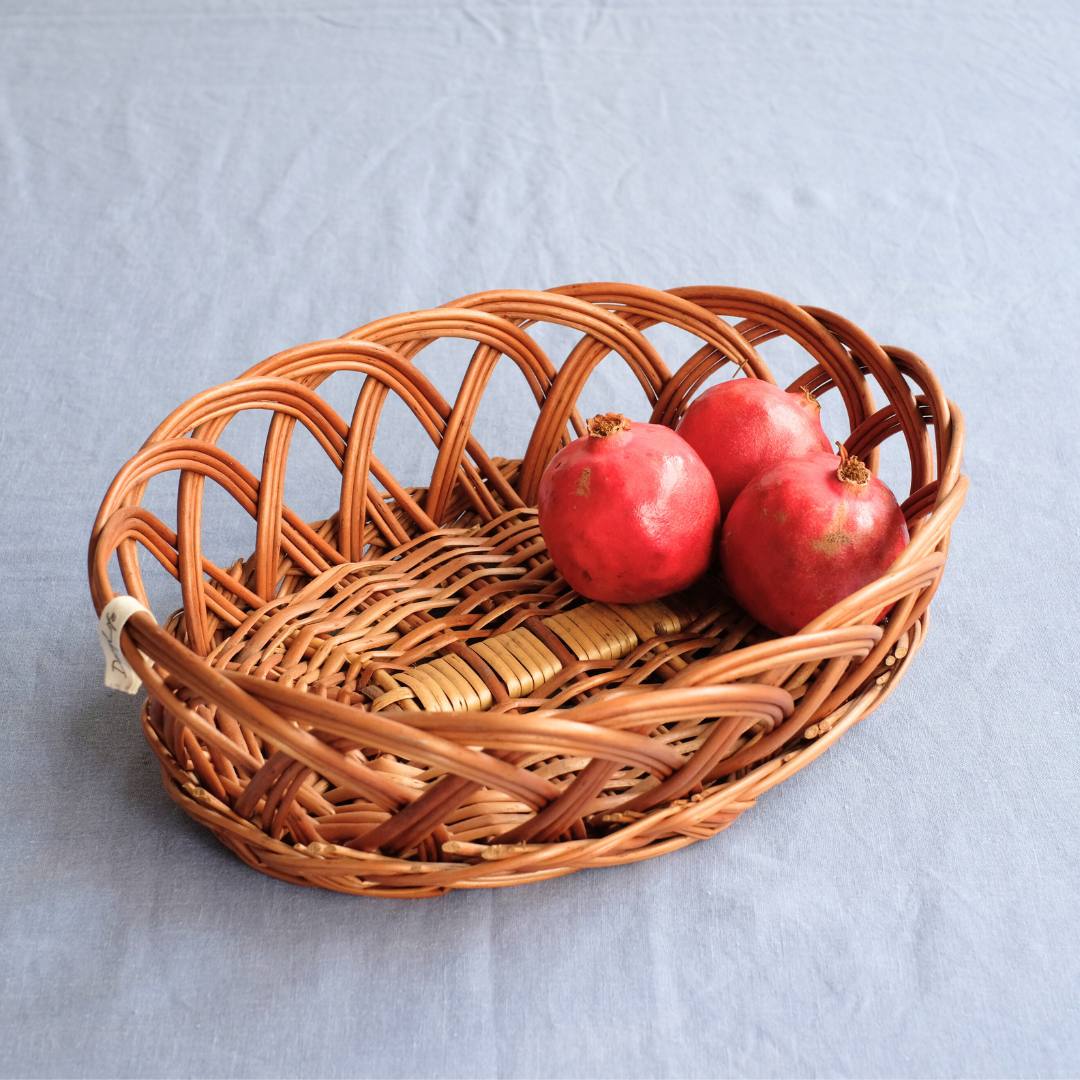 Oval Ring Wicker Basket with fruits.