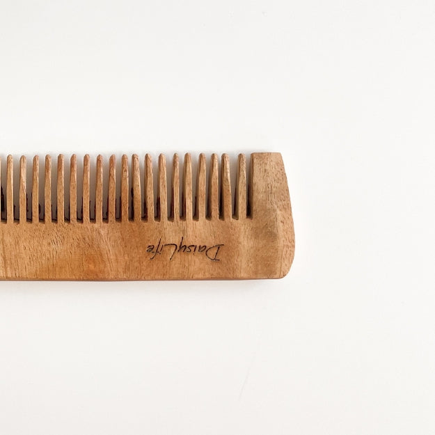 Close up of DaisyLife Small Neem Wooden Comb