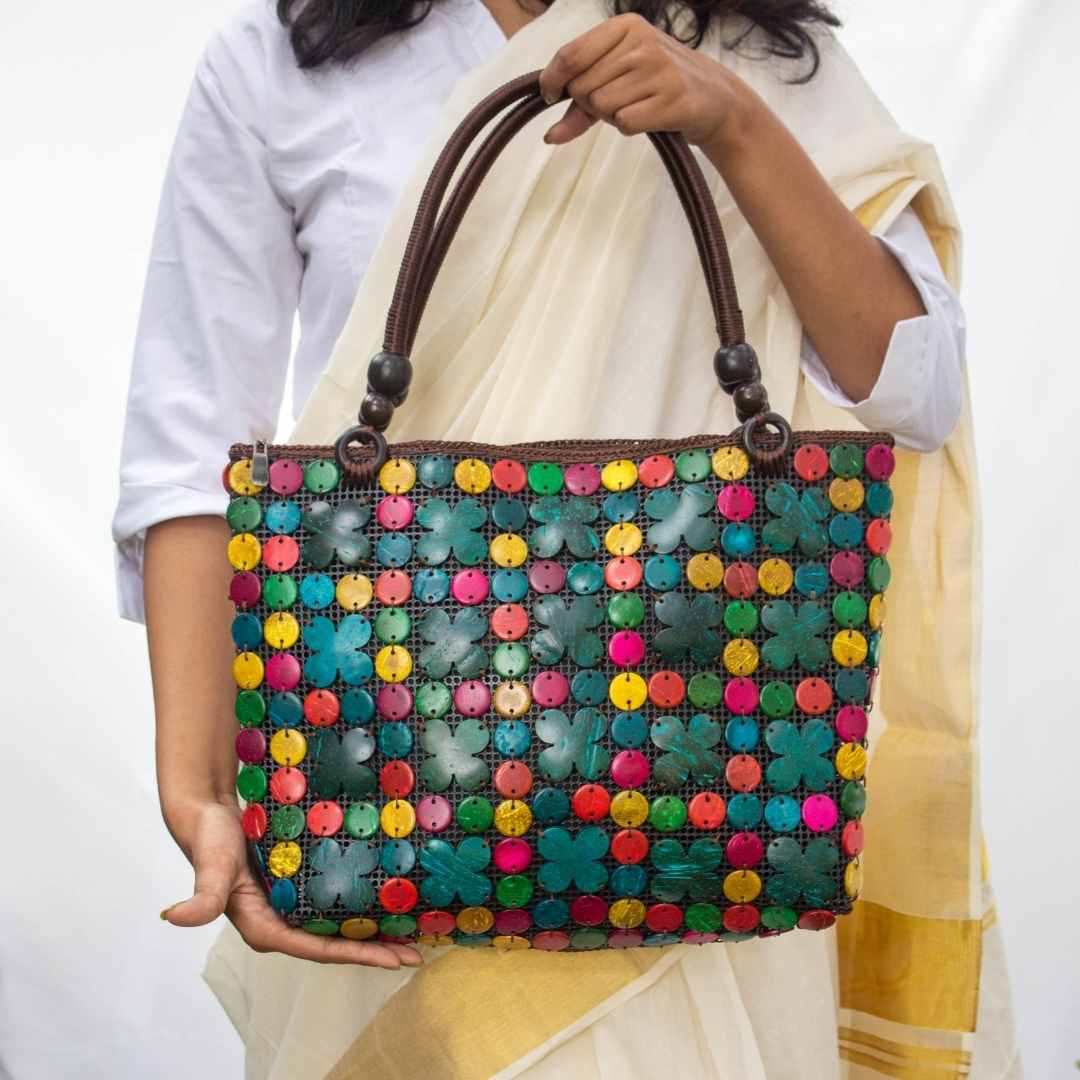 Women carrying natural coconut shell handbag