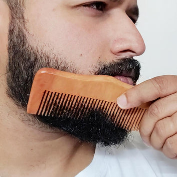 A man combing his beards