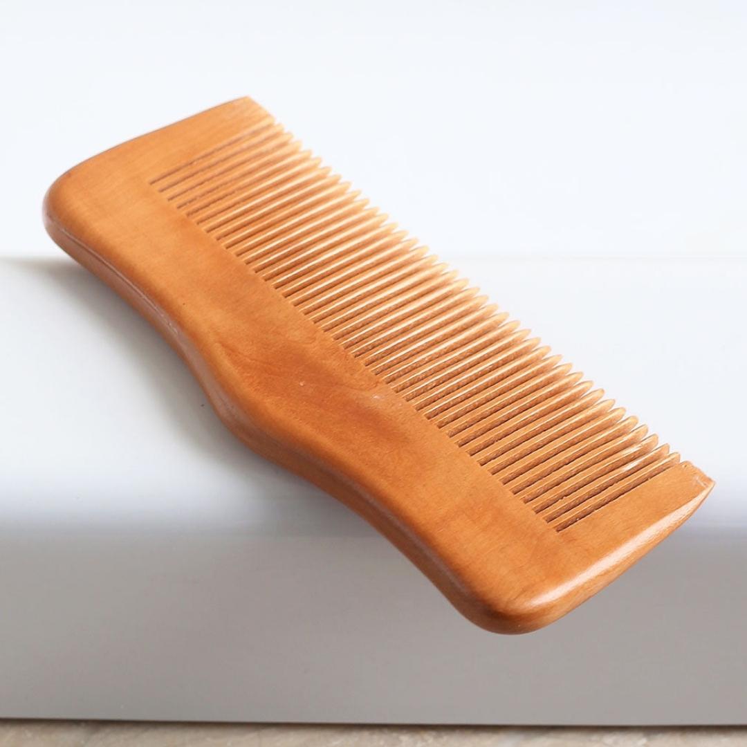 Solid natural wooden combs made from the beech tree side view