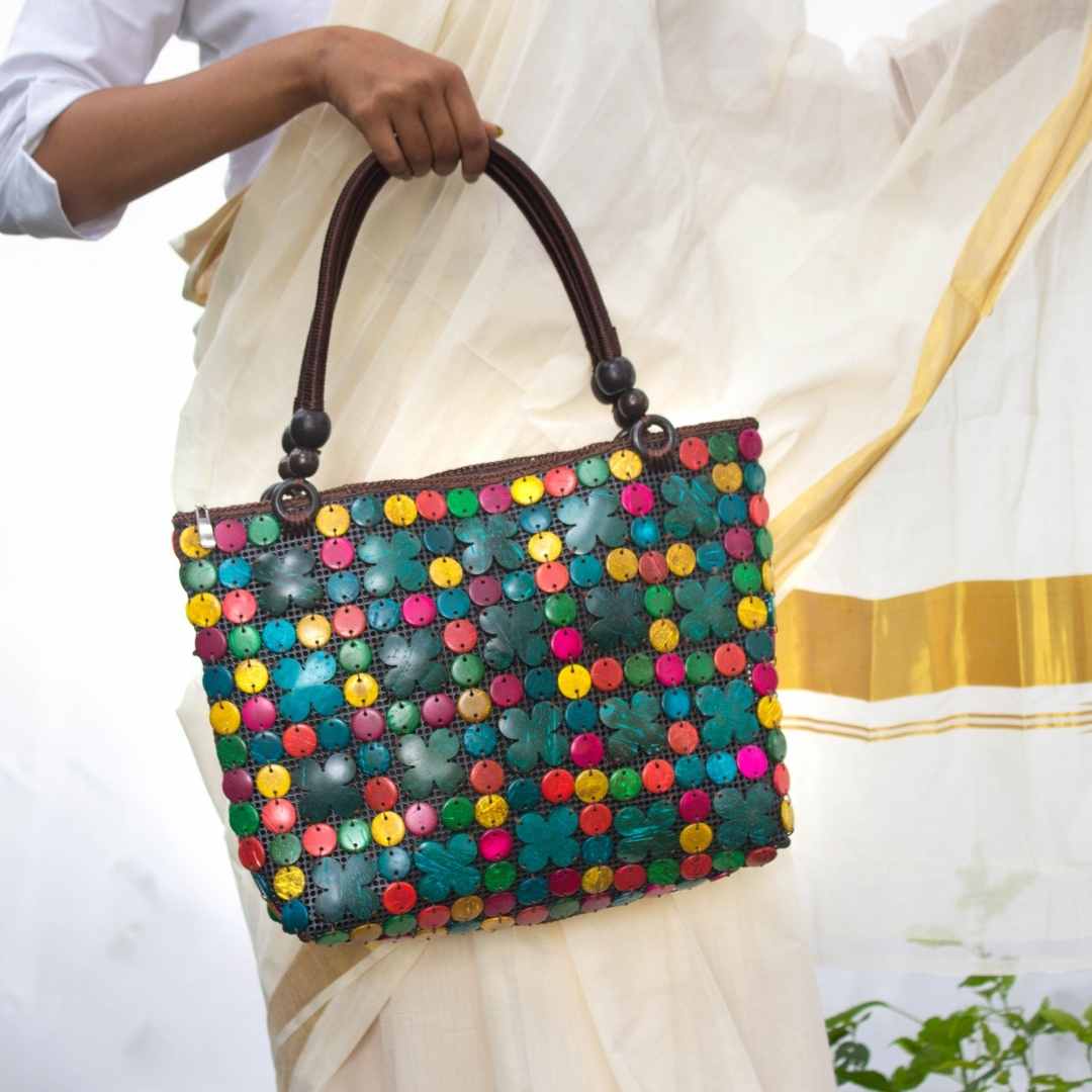 Women carrying natural coconut shell handbag