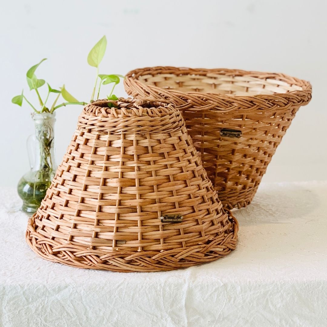 2 wicker handwoven lampshade kept upside down . 