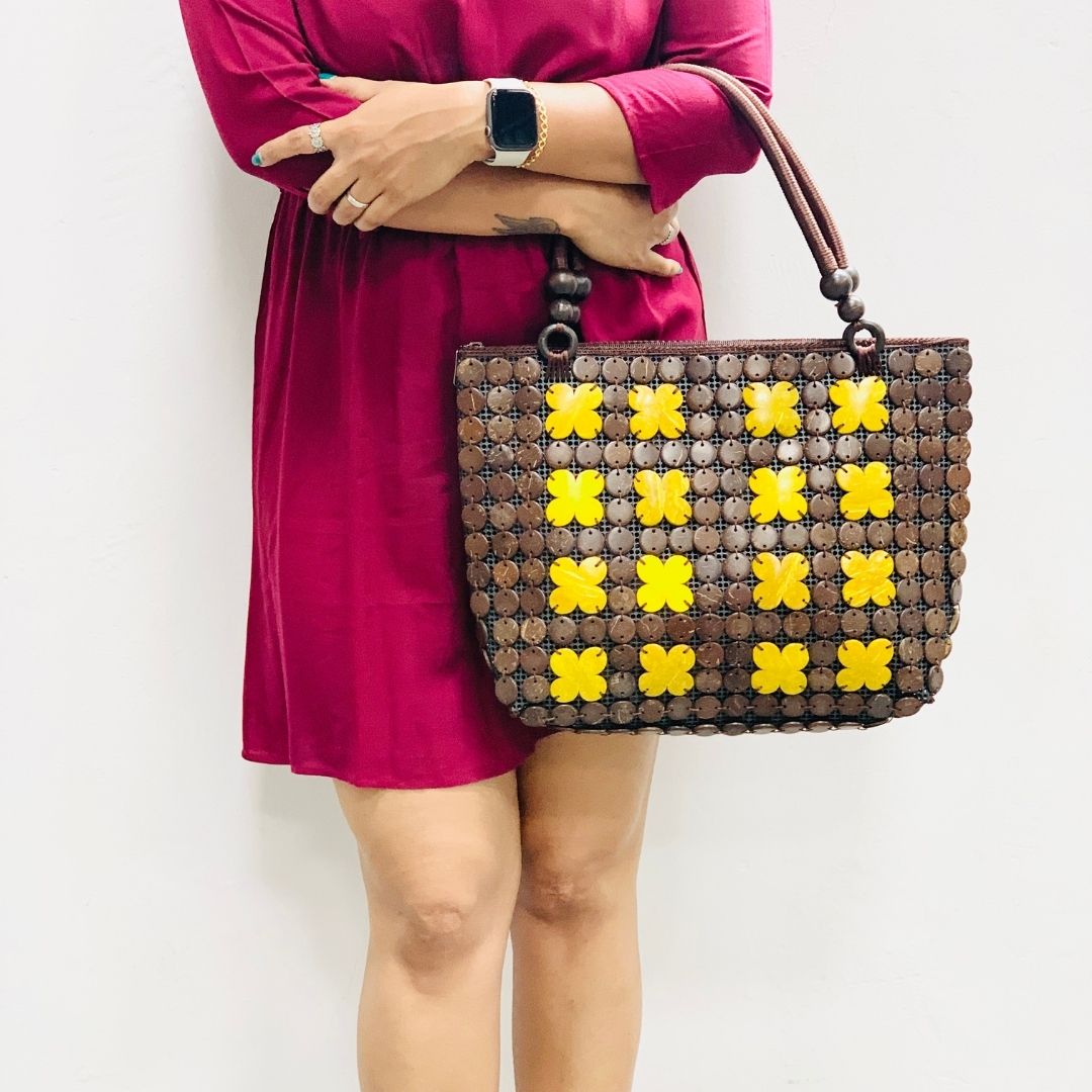 Women carrying natural coconut shell handbag