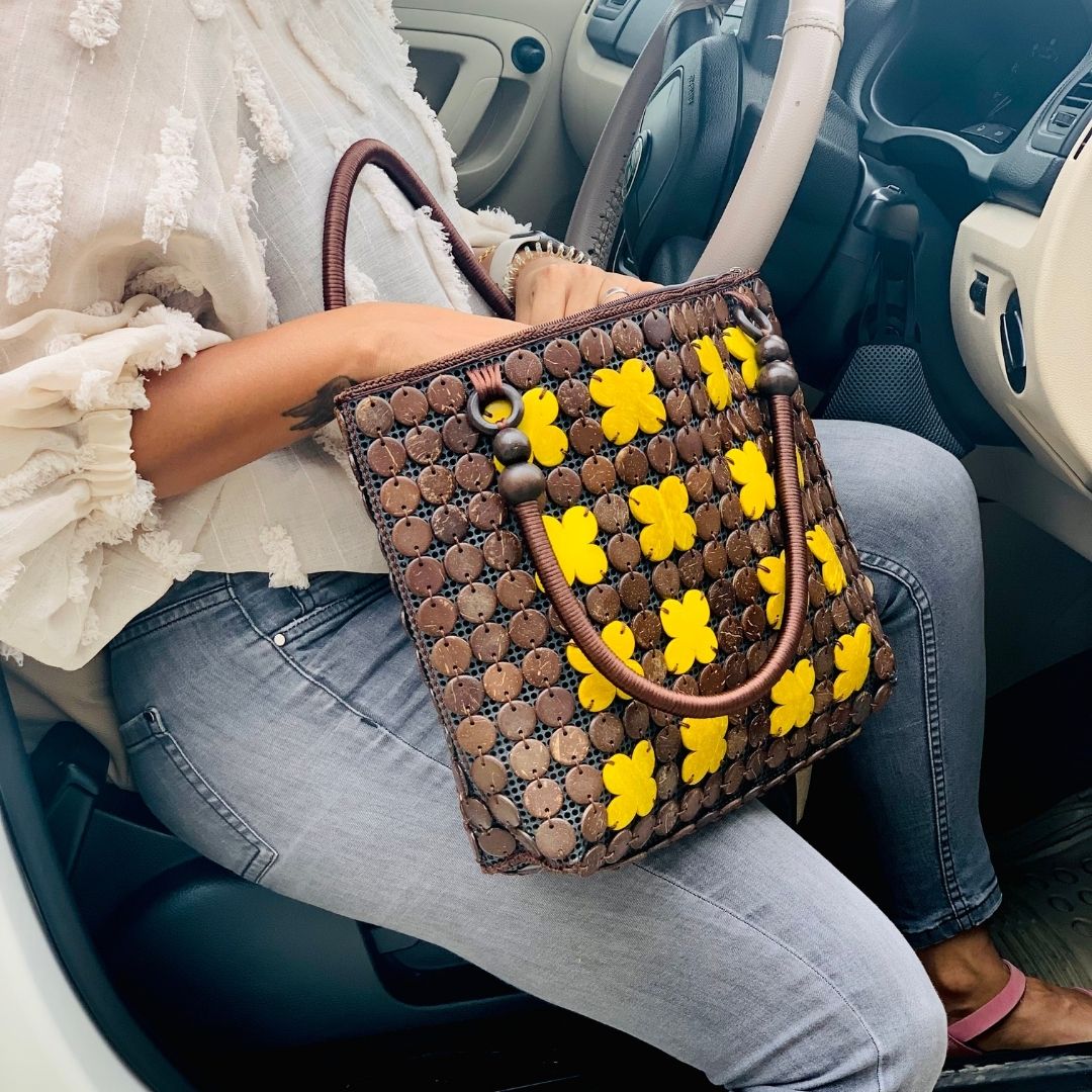 Women carrying natural coconut shell handbag