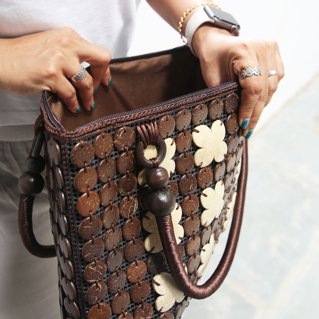 Women carrying natural coconut shell handbag