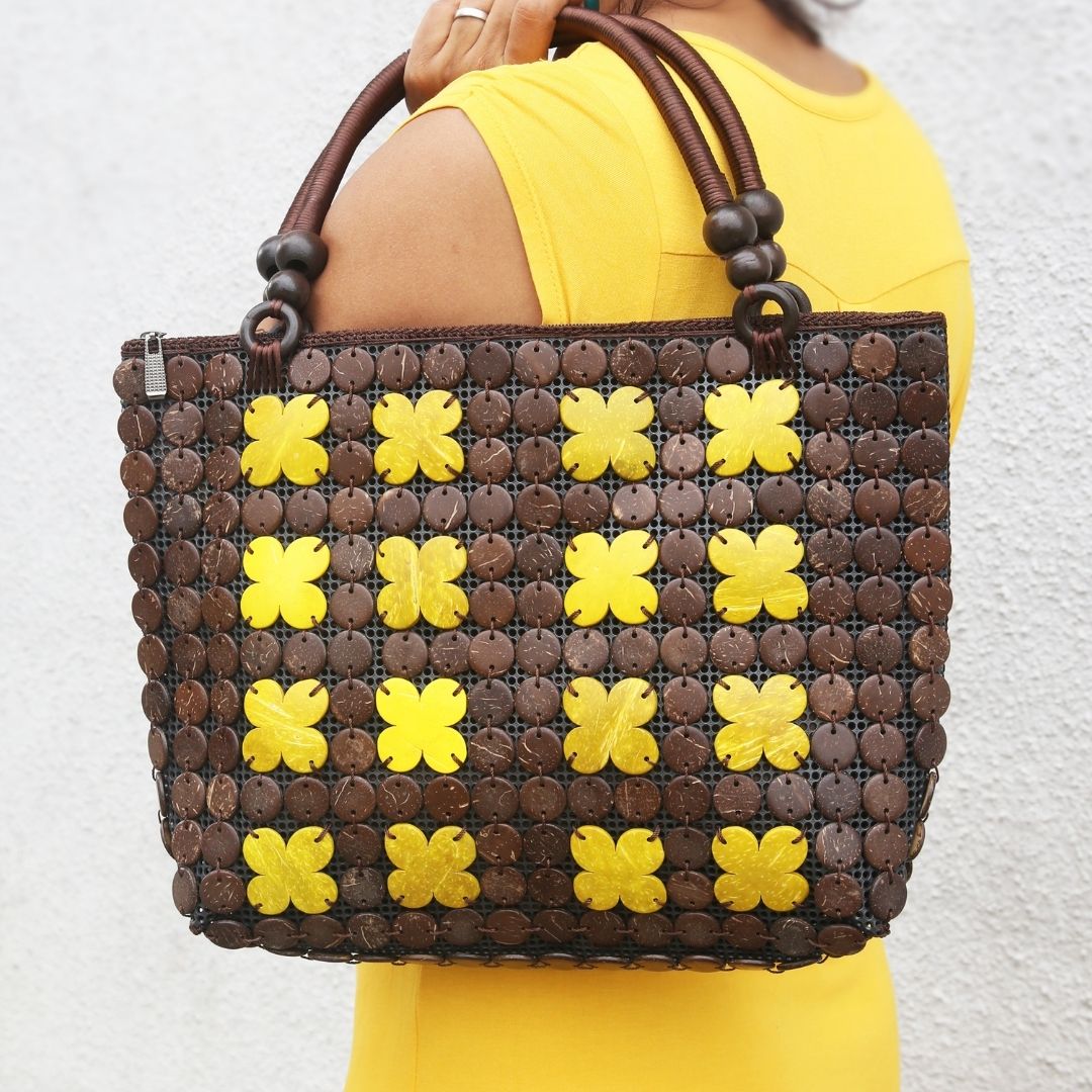 Women carrying natural coconut shell handbag