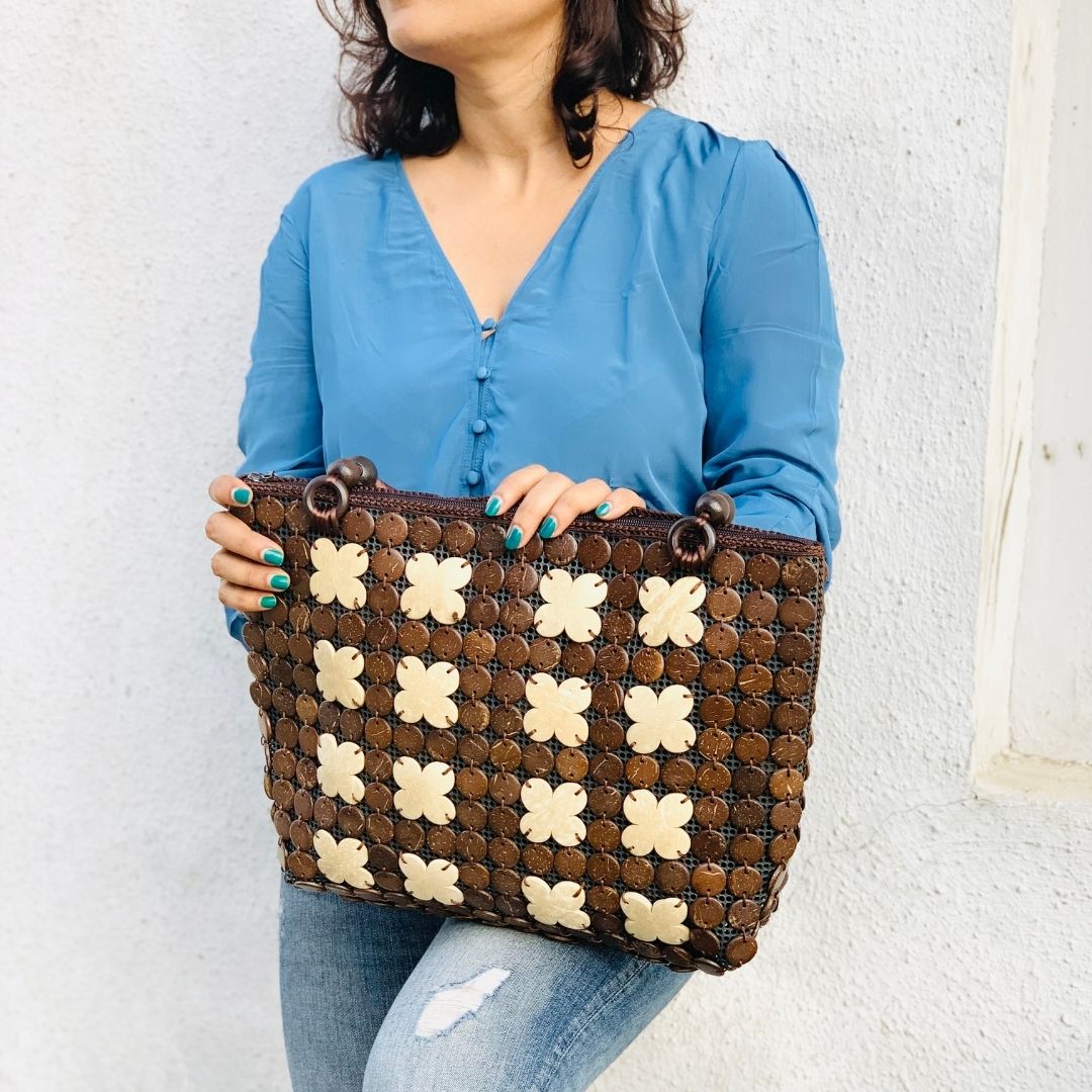 Women carrying natural coconut shell handbag