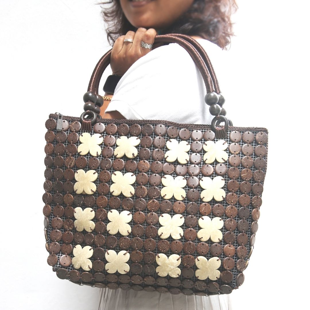 Women carrying natural coconut shell handbag