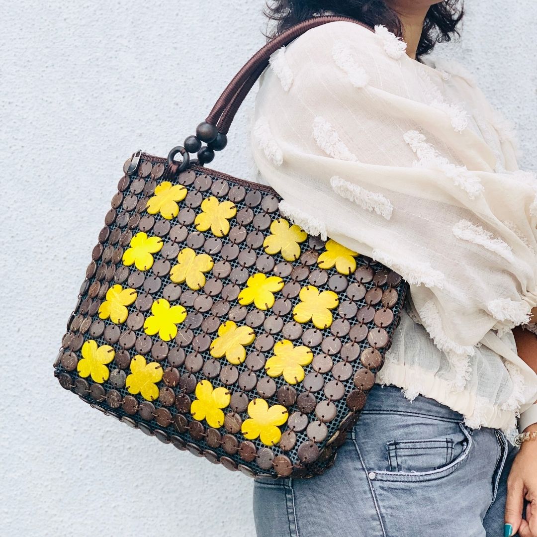 Women carrying natural coconut shell handbag