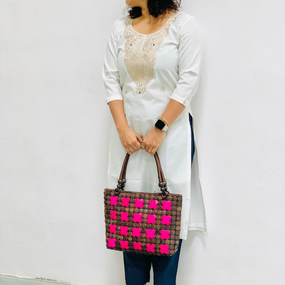 Women carrying natural coconut shell handbag