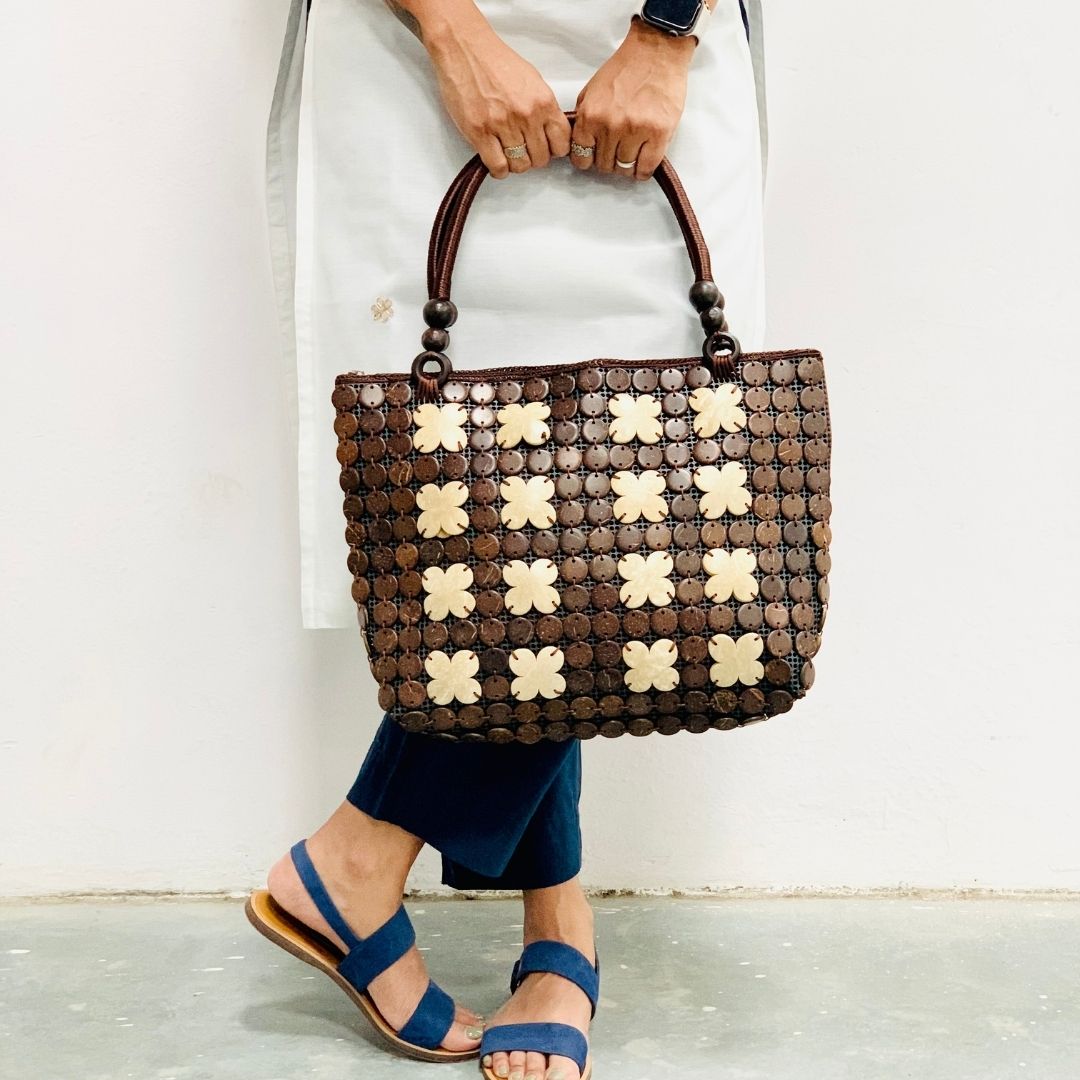 Women carrying natural coconut shell handbag