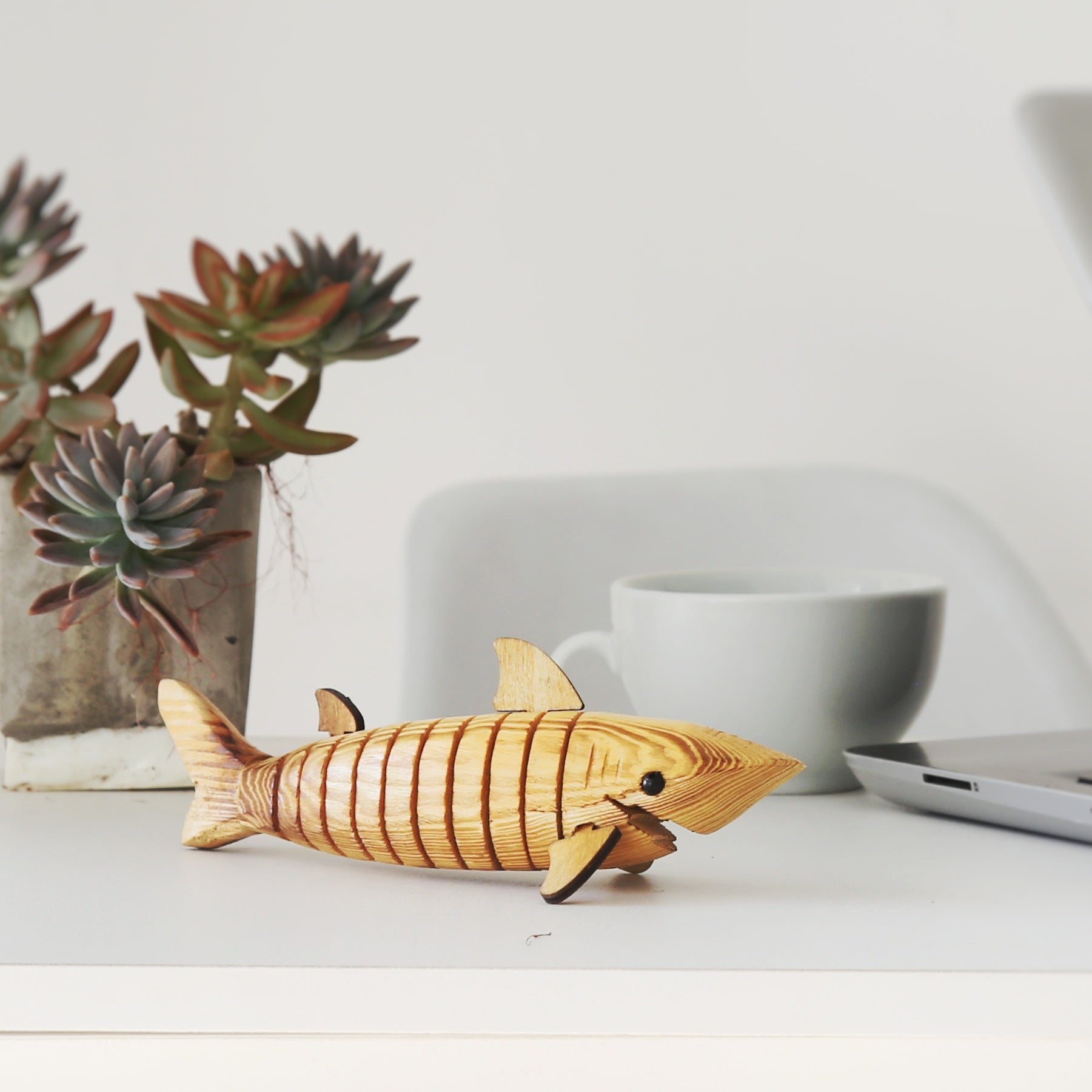 Wooden shark kept on the table as office room decor