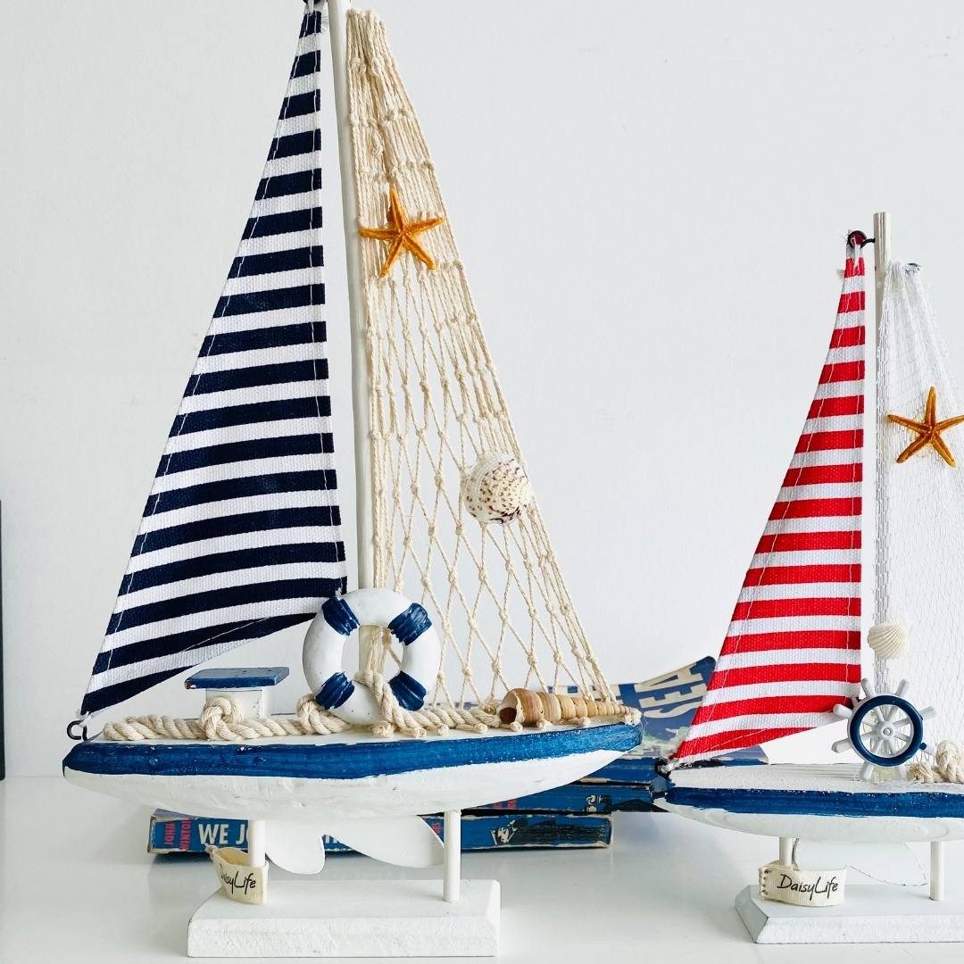 Wooden Natural coral/Seashell ship with blue flag, planter in background