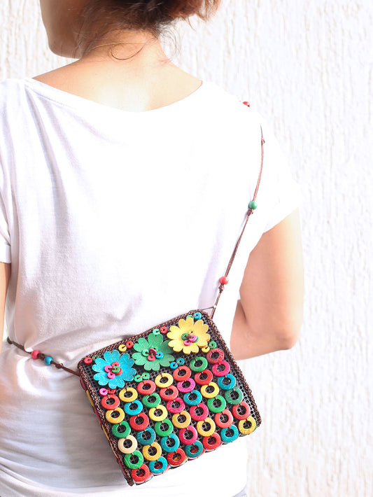 DaisyLife natural coconut shell multicolor floral fashion sling bag on model