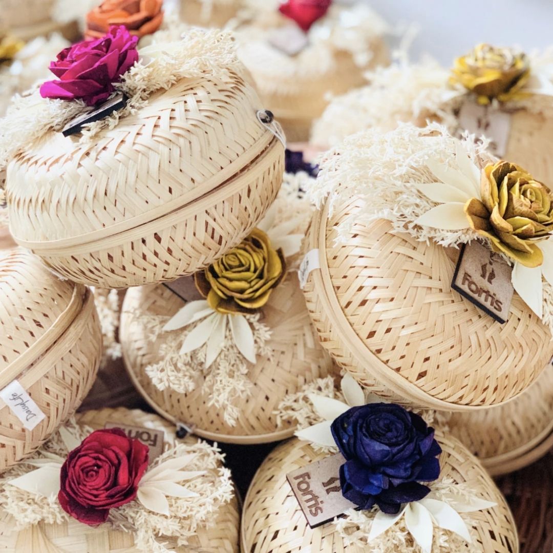 Natural bamboo gift basket with dried flower bow for gift packaging.