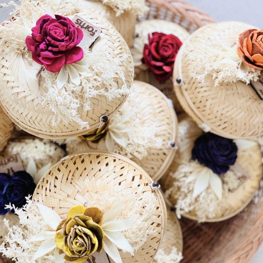 Natural bamboo gift basket with dried flower bow for gift packaging.