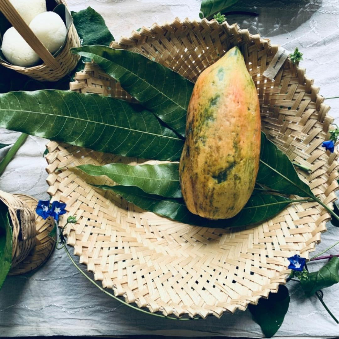 Papaya kept inside Simple & beautiful bamboo serving, Beautifully woven bamboo baskets.