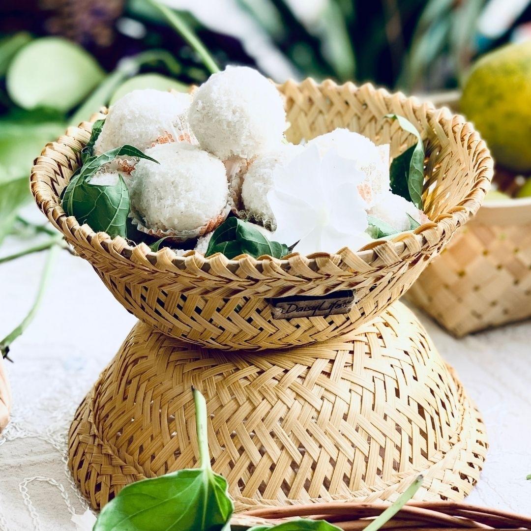 Laddoos kept inside Simple & beautiful bamboo serving, Beautifully woven bamboo baskets.