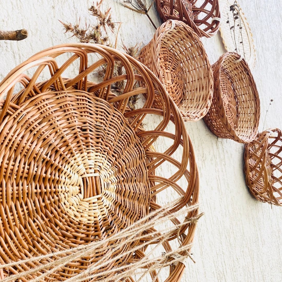 Crown wicker basket used in wall basket arrangement.