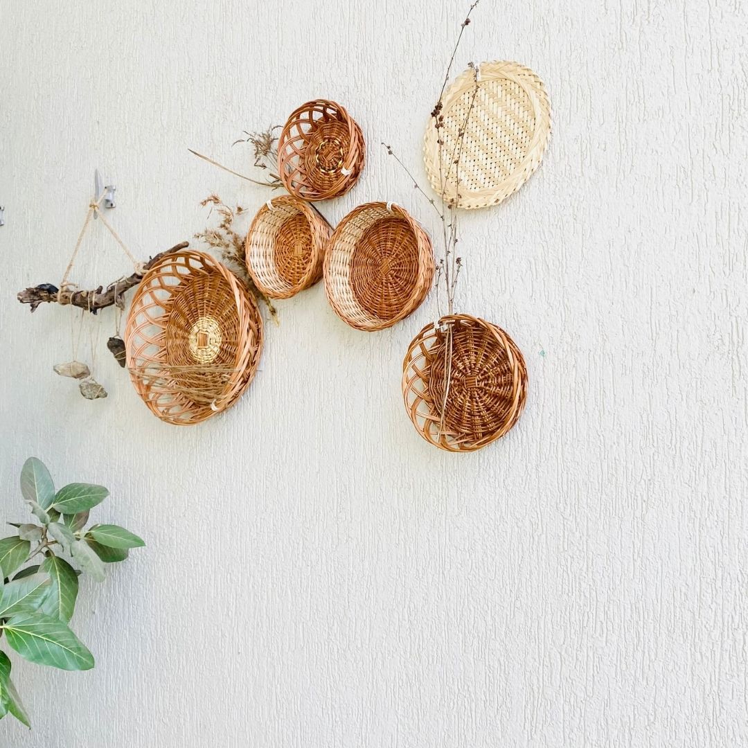 Mountain structured wall baskets decor in balcony with stones, and branches used as props