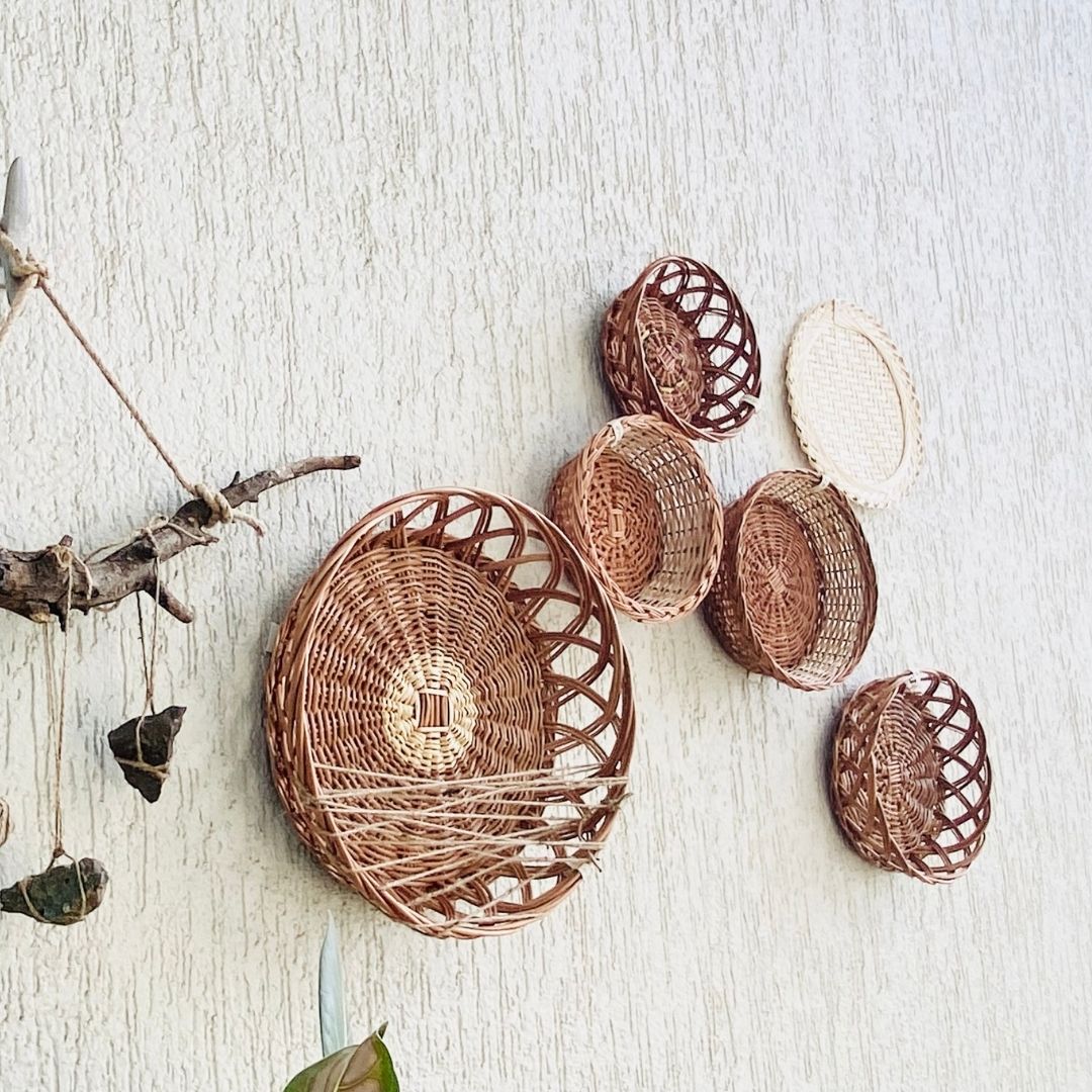 Mountain structured wall baskets decor in balcony with stones, and branches used as props